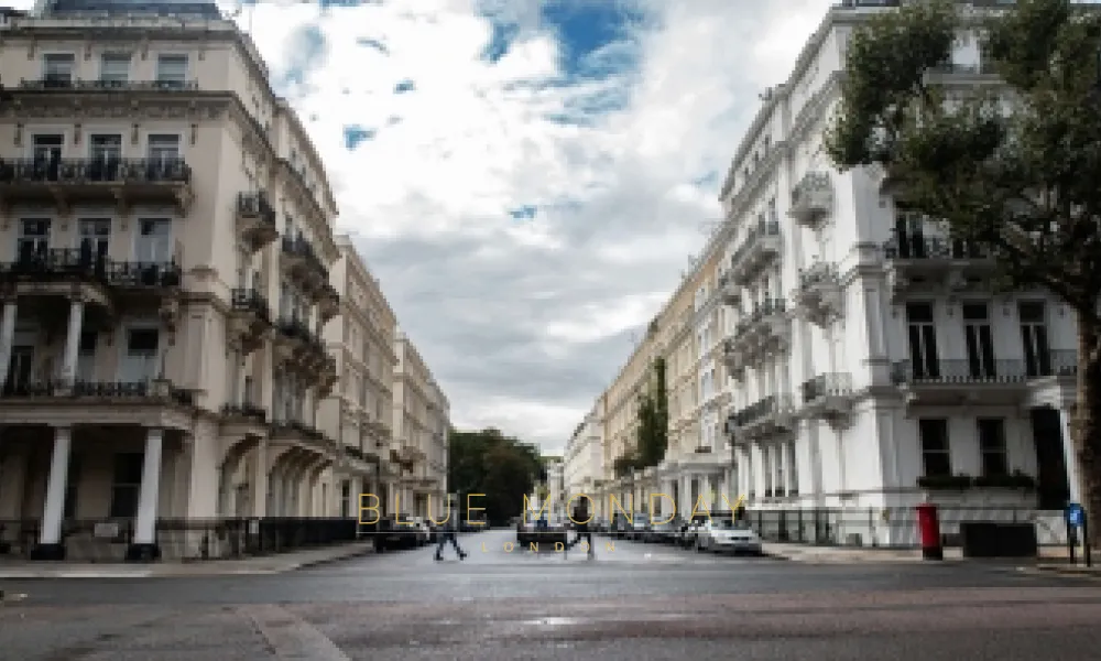 people walking across a street in Chelsea, London